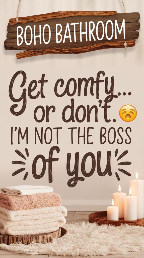 A witty wooden sign with ‘Get Comfy… Or Don’t. I’m Not the Boss of You’ hangs near a soft white bathrobe, adding personality to this black boho bathroom idea